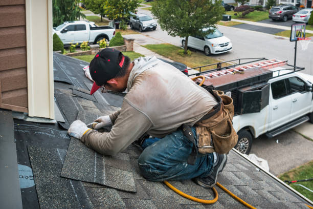 Professional Roofing technician working in Garden City Park, NY